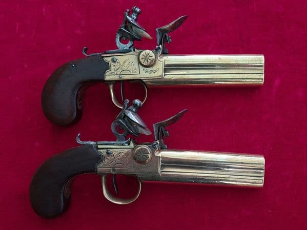 Pair of French over & Under double barrel brass tap action flintlock pistols. Circa 1780. Ref 3484